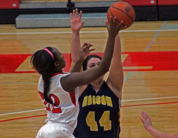 Karahn Scott goes up for two of her 17 points against Edison Community College on Feb. 20. Her performance over the past week earned her OCCAC Player of the Week honors. Photo by Dave Harrand/Owens Sports Information