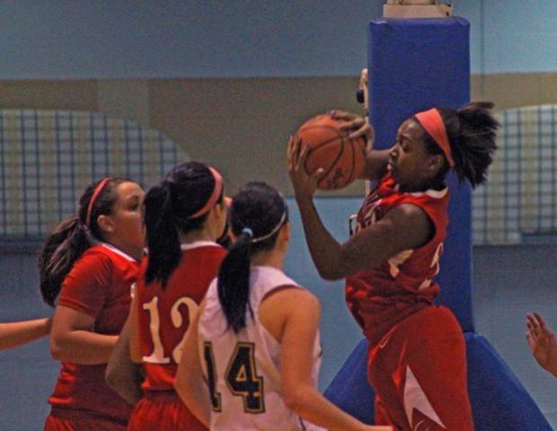 Karahn Scott pulls down one of her single game record 22 rebounds tonight. Photo by Dave Harrand/Owens Sports Information