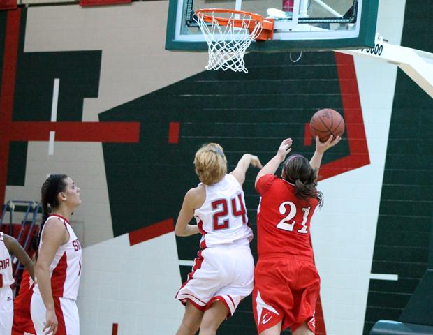 Mackenzie Heacock scores two of her team-high 15 points against Sinclair. Photo by Nicholas Huenefeld/Owens Sports Information
