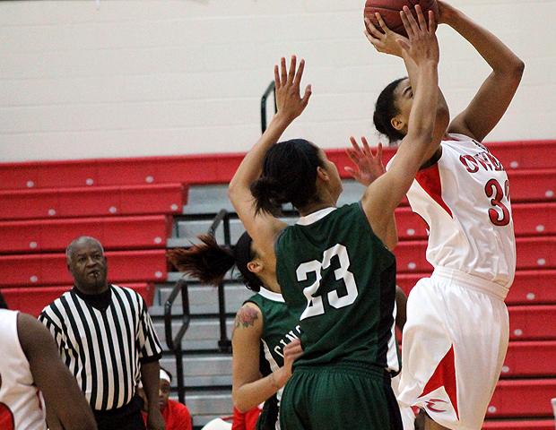 Ashley Tunstall scores down low in today's 88-82 win over No. 16 Cincinnati State. The freshman forward had a season-high 22 points, along with 10 rebounds for her third straight double-double. Photo by Kyle Whitaker/Owens Sports Information