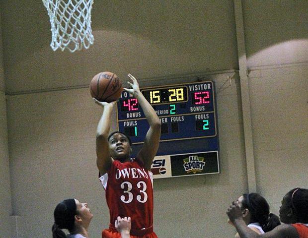 Ashley Tunstall attempts a jumper in the paint in the second half of today's 86-67 win over Edison Community College. Photo by Geoff Roberts/Owens Sports Information
