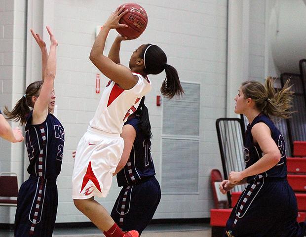 Kamilah Carter pulls up for a jumper in the paint during the second half of today's 84-51 win over Kirtland Community College. The sophomore had a team-high 17 points and seven assists. Photo by Nicholas Huenefeld/Owens Sports Information
