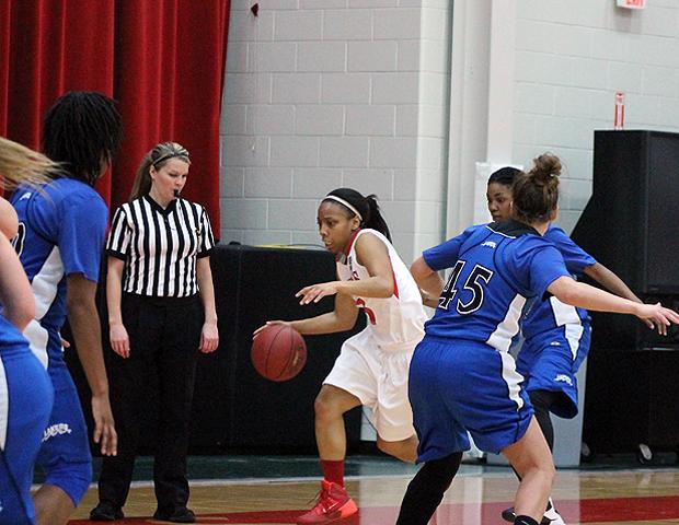 Kamilah Carter drives the baseline in today's 83-38 win over Lakeland Community College. The sophomore had a game-high 24 points. Photo by Nicholas Huenefeld/Owens Sports Information