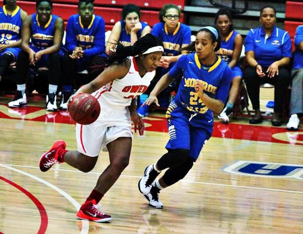 Sierra Harley drives past Monroe's Aaliyah Mercer in the second half of today's 88-76 win. Photo by Nicholas Huenefeld/Owens Sports Information