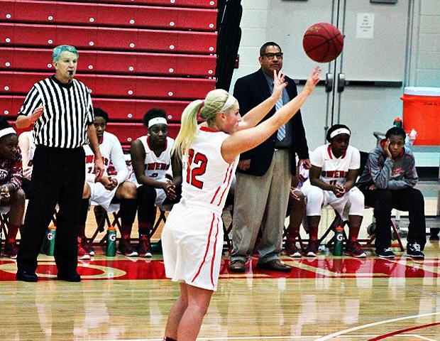 Demy Whitaker attempts a 3-point field goal. The freshman made seven from long distance for the second straight game and broke the single game record for steals with 13. Photo by Nicholas Huenefeld/Owens Sports Information