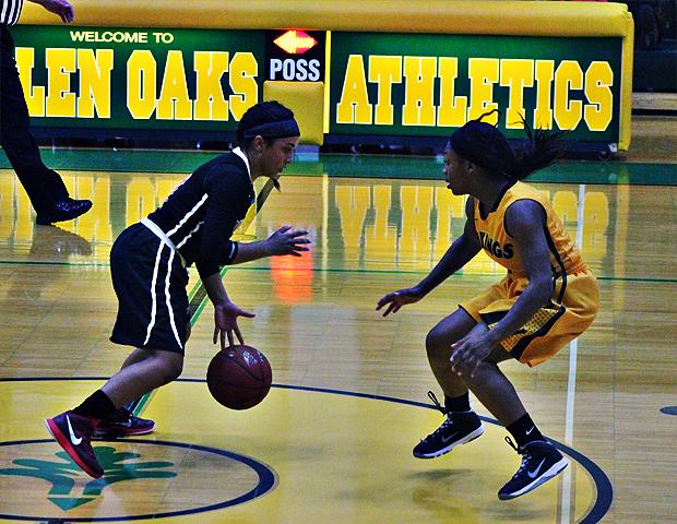 Briana Williams looks to make a move against a Glen Oaks defender in tonight's 74-51 win. Photo by Nicholas Huenefeld/Owens Sports Information