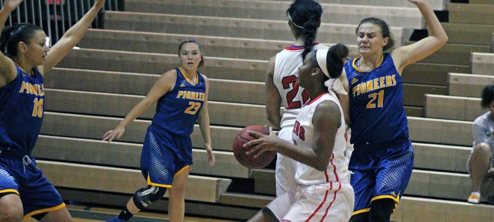 Tatyana Reynolds looks to pull up just inside the 3-point line in the second half of today's 75-62 loss. Photo by Nicholas Huenefeld/Owens Sports Information
