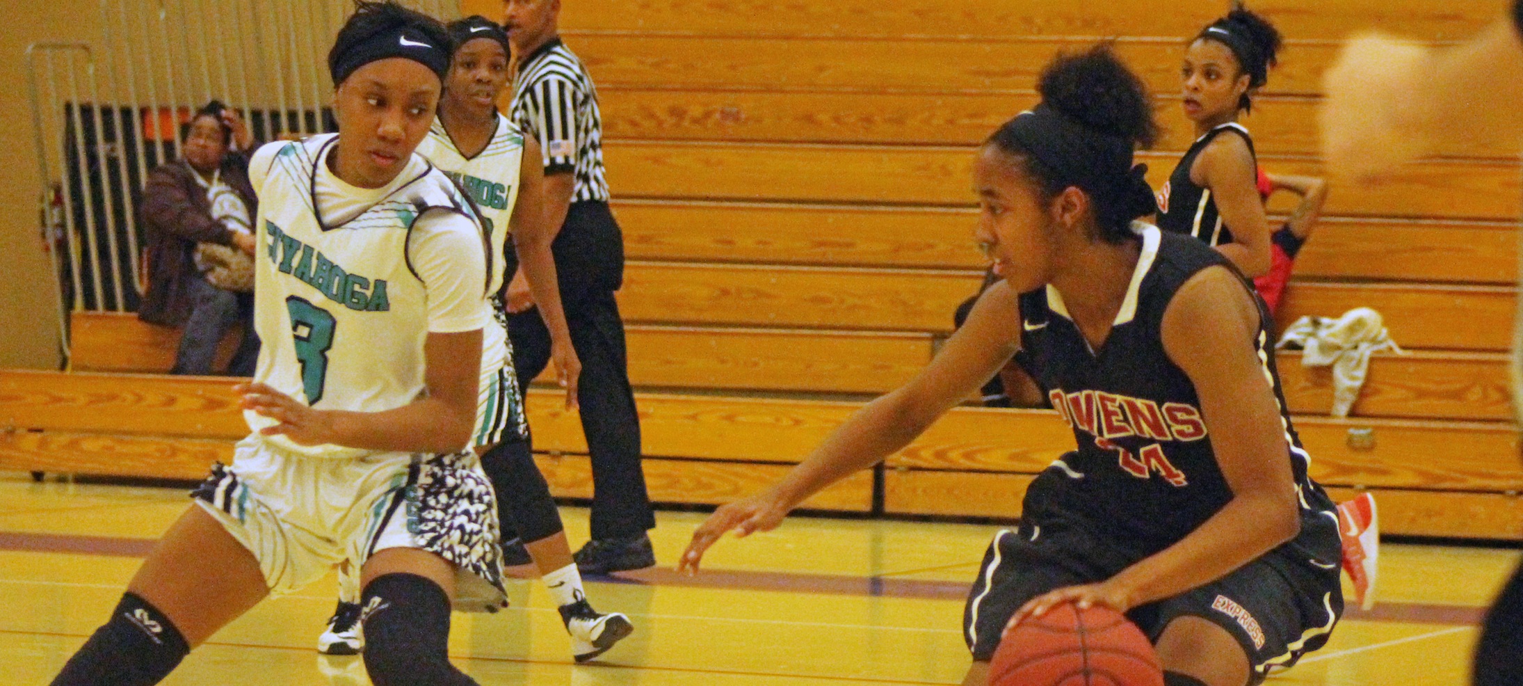 Ariel Bethea dribbles the ball with a Tri-C defender nearby. The sophomore guard broke the single season steals record tonight. Photo by Nicholas Huenefeld/Owens Sports Information