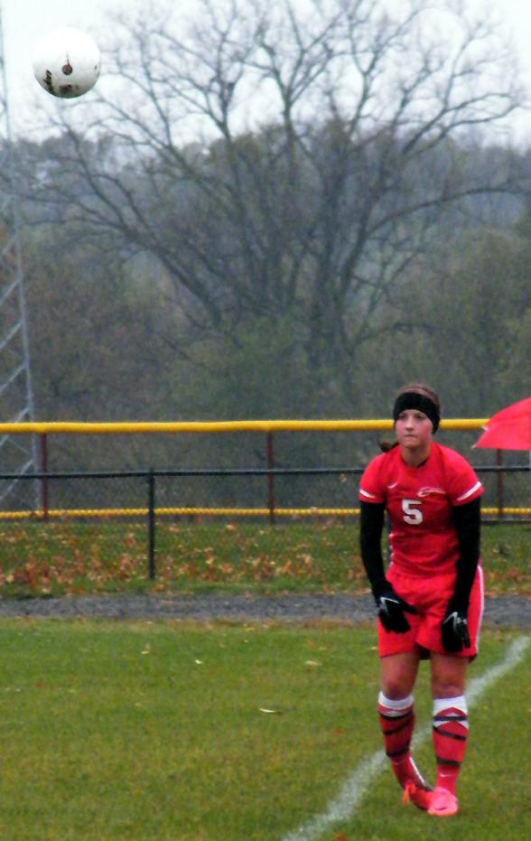 Erica Lankey throws the ball in against Jackson. Photo by Nicholas Huenefeld