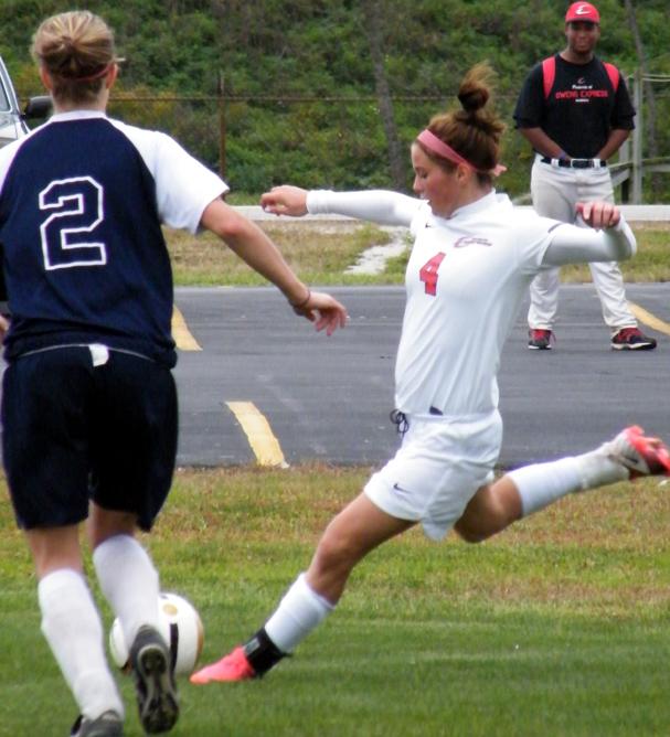 Marissa Szabo crosses the ball against Lorain County. She has nine goals in the past four games. Photo by Nicholas Huenefeld