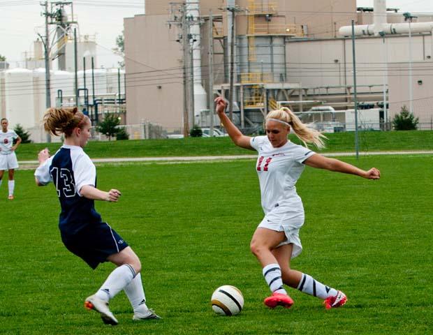 Kendra Eitniear jukes a Lorain defender on the way to one of her four goals. Photo by Seth Foley