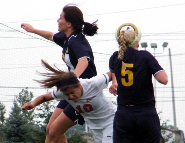 Haley Gasser fights for the ball. Photo by Nicholas Huenefeld