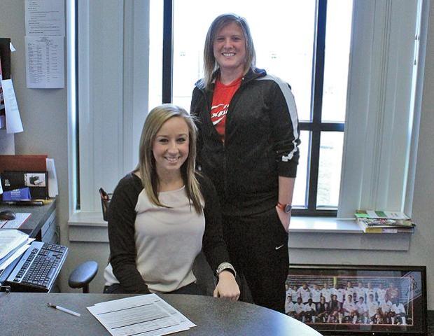 Lacee Ortman poses with Express women's soccer head coach Mary Whisler after signing a letter of intent to play for Whisler and the Express next year. Photo by Nicholas Huenefeld/Owens Sports Information