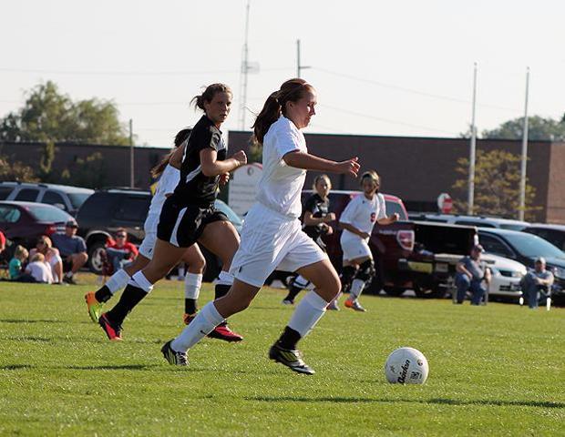 Haley Kreger, pictured here with the ball, scored the game winning goal in today's 2-1 double overtime victory over No. 11 Schoolcraft College. Photo by Nicholas Huenefeld/Owens Sports Information