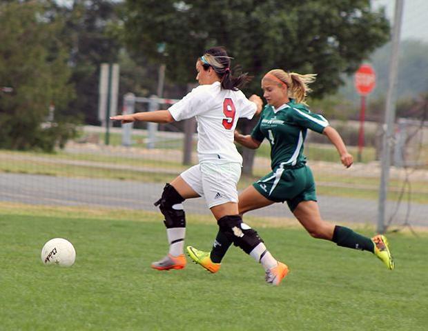 Jessica Grindle prepares to strike the ball for her second goal of the day. The sophomore finished with three goals and one assist. Photo by Nicholas Huenefeld/Owens Sports Information