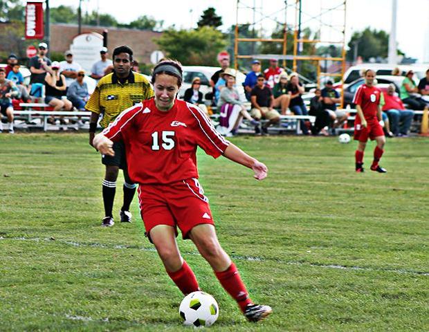 With her left foot, Jessica Kreger scores the game winner just minutes into overtime of today's 2-1 win over Lake Michigan. Photo by Nicholas Huenefeld/Owens Sports Information
