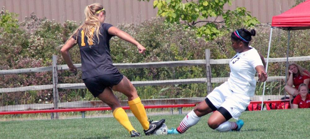 Jermima Job makes a play against a Parkland player in today's game. Photo by Katie Turski/Owens Sports Information