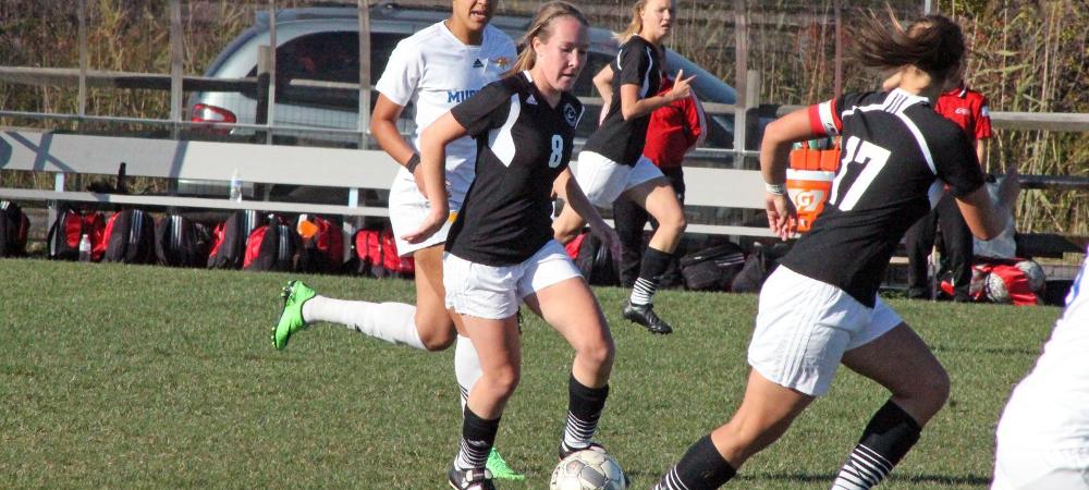 Catie Phalen (8), looks to make a pass to a teammate during today's loss to Monroe College. Photo by Nicholas Huenefeld/Owens Sports Information