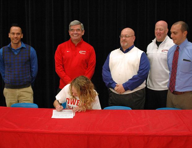 Aricka LaVoy is surrounded by Eastwood volleyball head coach Jeff Beck, Express volleyball head coach Sonny Lewis, Eastwood HS principal Jeff Hill, Express volleyball assistant coach Denny Caldwell and Eastwood HS Athletic Director Chris Fahim as she signs her letter of intent to play for the Express next year. Photo by Nicholas Huenefeld/Owens Sports Information