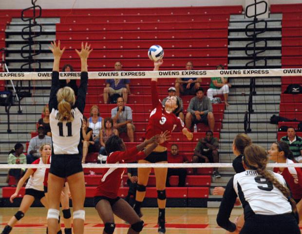 Alyssa Meis hits the ball against No. 8 Johnson County. The Express upset the previously unbeaten team in straight sets before sweeping No. 20 Genesee Community College on Saturday. Photo by Nicholas Huenefeld/Owens Sports Information