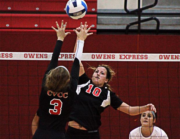 Macy Reigelsperger lofts an attack shot over the hands of a player from Catawba Valley in today's first match. She became the first player this year to 100 kills, and she now has 111 in the team's first eight matches. Photo by Nicholas Huenefeld/Owens Sports Information