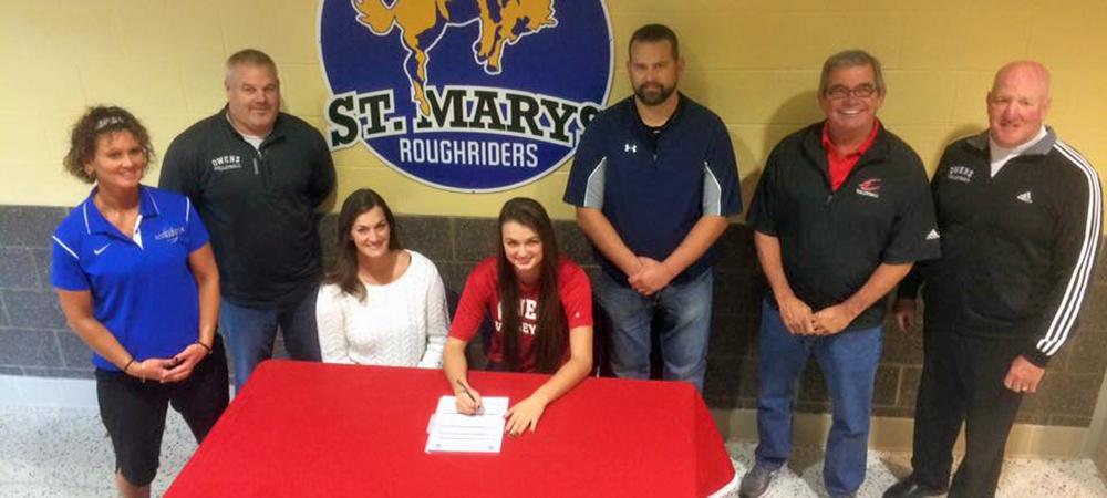Erika Angstmann signs her LOI while surrounded by her family and coaches. Photo provided to Owens Sports Information