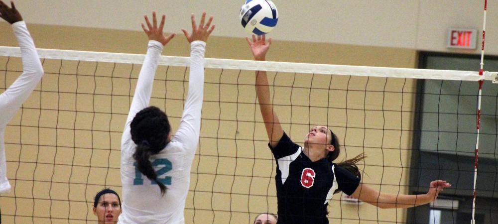Annie Lindeman makes an offensive play against a Cuyahoga defender in tonight's match. Photo by Nicholas Huenefeld/Owens Sports Information