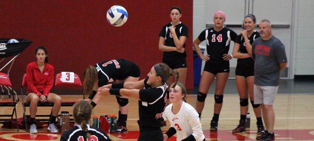 Ally Mikesell grabs a ball in traffic against Edison today. The sophomore had a team-high 11 digs. Photo by Nicholas Huenefeld/Owens Sports Information