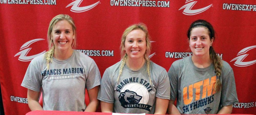 Deanna Smith, center, is joined by her fellow sophomores Erika Hartings (L) and Macy Reigelsperger (R), who are all wearing the shirts of their four-year schools. Photo by Nicholas Huenefeld/Owens Sports Information