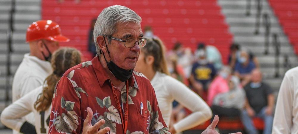 Head coach Sonny Lewis talks with his team during a timeout during the Sept. 17 match against Muskegon.